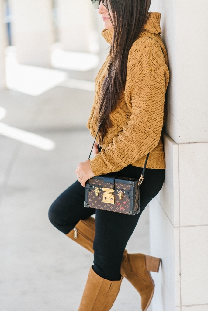 Luxury Handbag Collection and Review featured by top US fashion blog, LuxMommy: image of a woman wearing a Louis Vuitton petite malle