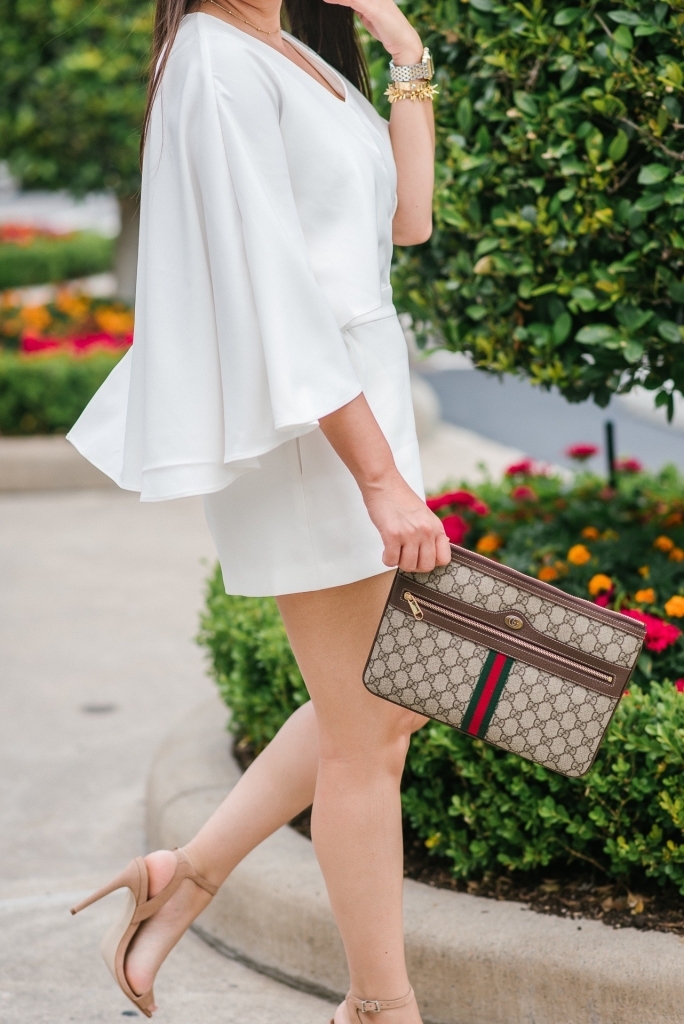 Luxury Handbag Collection and Review featured by top US fashion blog, LuxMommy: image of a woman wearing a Gucci Ophidia pouch