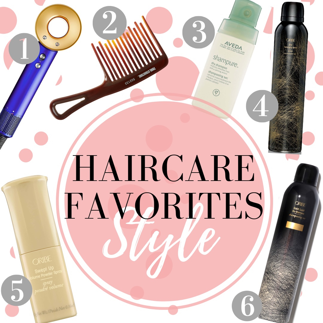 Woman styling hair with a selection of premium hair products arranged around her