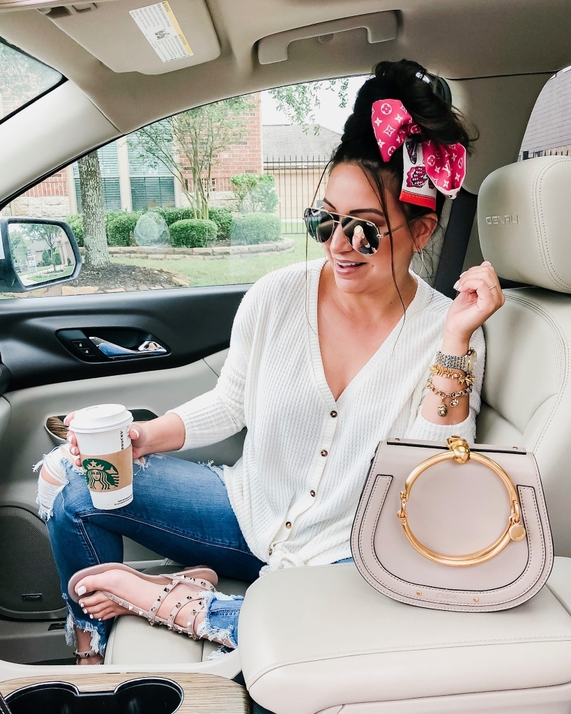 Top 10 Best Non Coffee Starbucks Drinks Under 100 Calories featured by top US life and style blog, LuxMommy: image of a woman sitting in a car holding a Starbucks cup