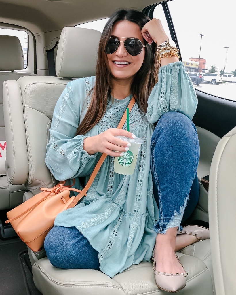 Top 10 Best Non Coffee Starbucks Drinks Under 100 Calories featured by top US life and style blog, LuxMommy: image of a woman sitting in a car holding a Starbucks cup