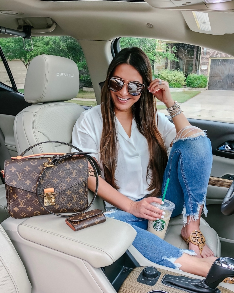 Top 10 Best Non Coffee Starbucks Drinks Under 100 Calories featured by top US life and style blog, LuxMommy: image of a woman sitting in a car holding a Starbucks cup