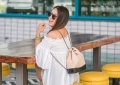 Chanel Gabrielle backpack, White smocked off the shoulder top, quay Jaclyn Hill sunglasses, american eagle midi shorts, Michele watch, stella and dot renegade bracelet, kendra scott charm bracelet, Walmart espadrilles