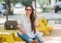 Rainbow smocked top styled for summer by top US fashion blog, LuxMommy: image of a woman wearing a Madewell rainbow smocked top, Express mid rise jeans, Tory Burch flip flops, Kendra Scott drop earrings, Michele diamond watch, Stella & Dot spike bracelet and Louis Vuitton crossbody bag.