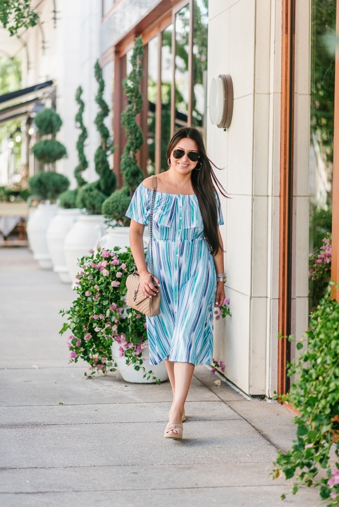 Cute Summer Dresses from Walmart featured by top US fashion blog, LuxMommy: image of a woman wearing a Sofia by Sofia Vergara off the shoulder dress.