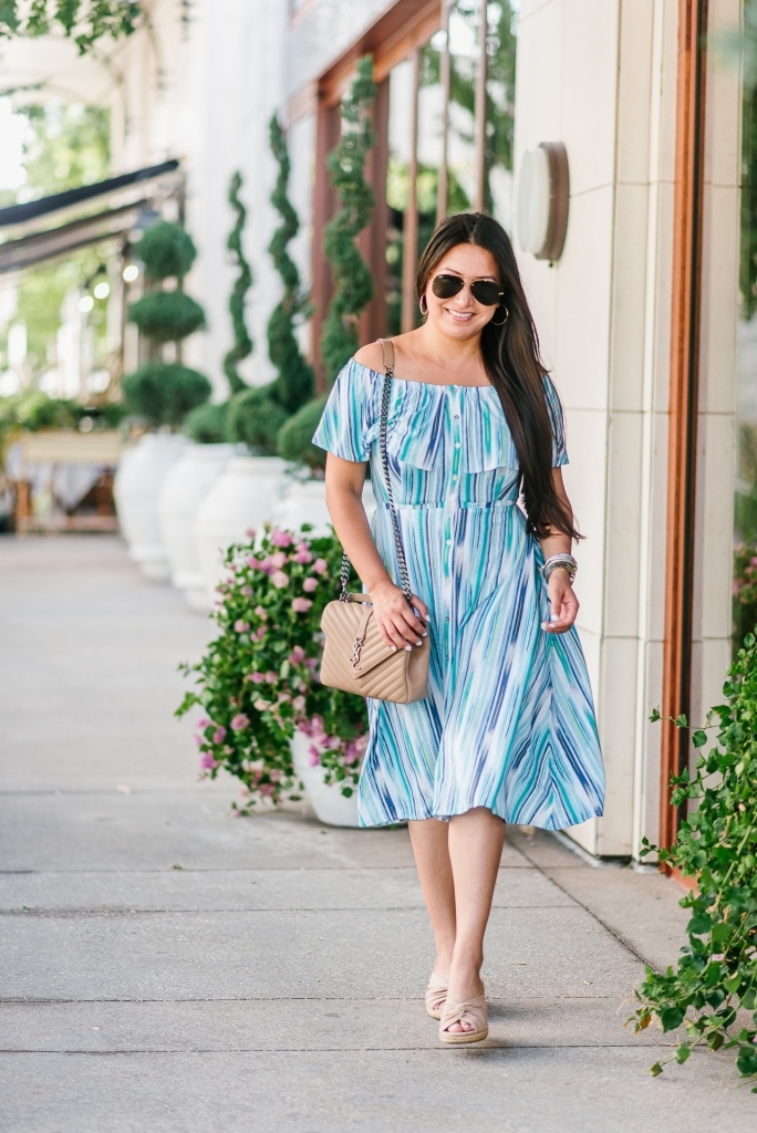 Cute Summer Dresses from Walmart featured by top US fashion blog, LuxMommy: image of a woman wearing a Sofia by Sofia Vergara off the shoulder dress.
