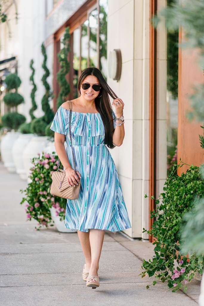Cute Summer Dresses from Walmart featured by top US fashion blog, LuxMommy: image of a woman wearing a Sofia by Sofia Vergara off the shoulder dress.
