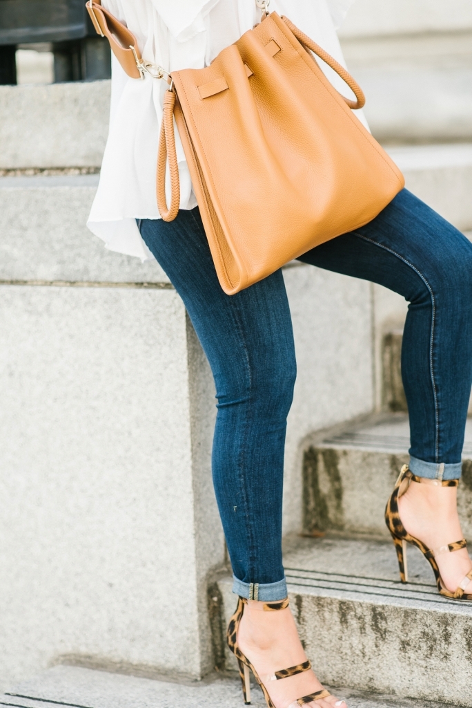 My New Tamara Mellon Handbag and Shoe Obsession by popular Texas fashion blog, Lux Mommy: image a woman standing on stairs outside and wearing Tamara Mellon leopard print Frontline 105 shoes and a Tamara Mellon Kiss Bag.