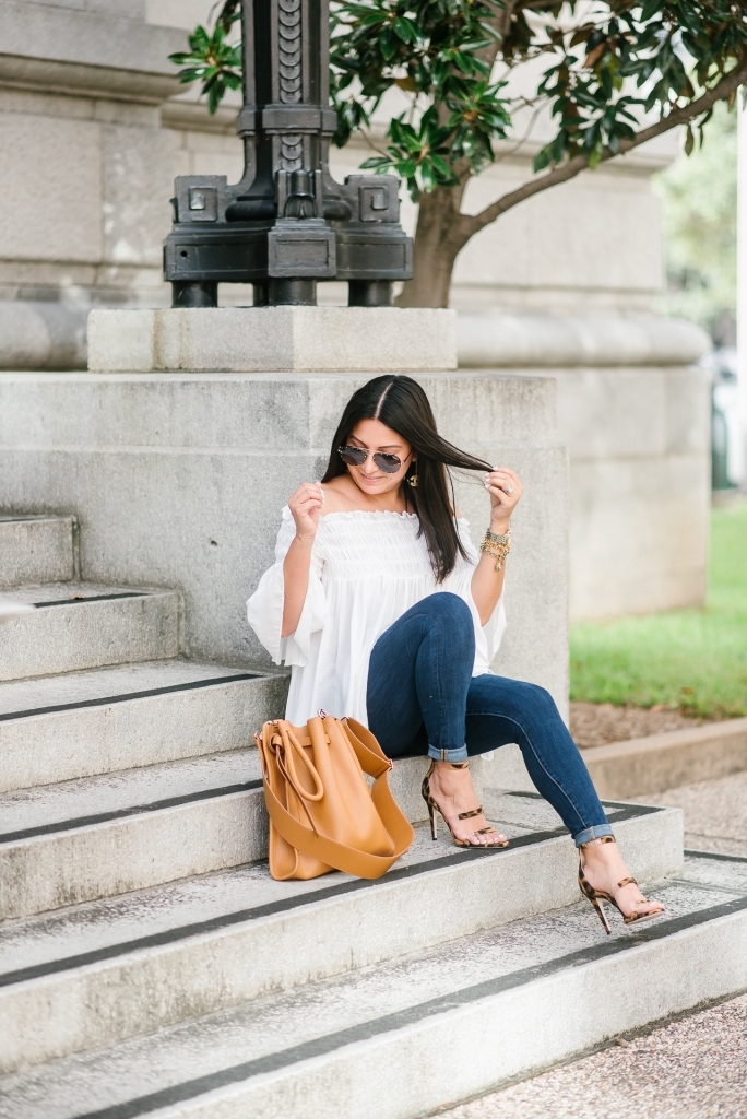 My New Tamara Mellon Handbag and Shoe Obsession by popular Texas fashion blog, Lux Mommy: image a woman sitting on stairs outside and wearing Tamara Mellon leopard print Frontline 105 shoes and a Tamara Mellon Kiss Bag.