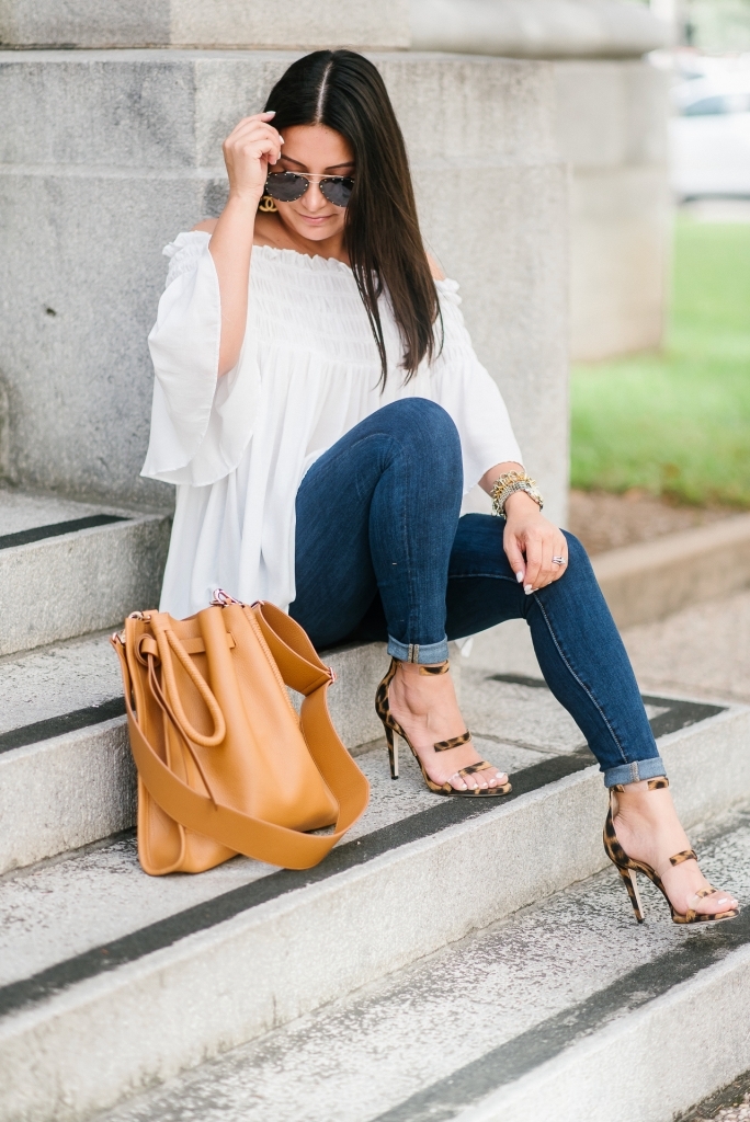 My New Tamara Mellon Handbag and Shoe Obsession by popular Texas fashion blog, Lux Mommy: image a woman sitting on stairs outside and wearing Tamara Mellon leopard print Frontline 105 shoes and a Tamara Mellon Kiss Bag.