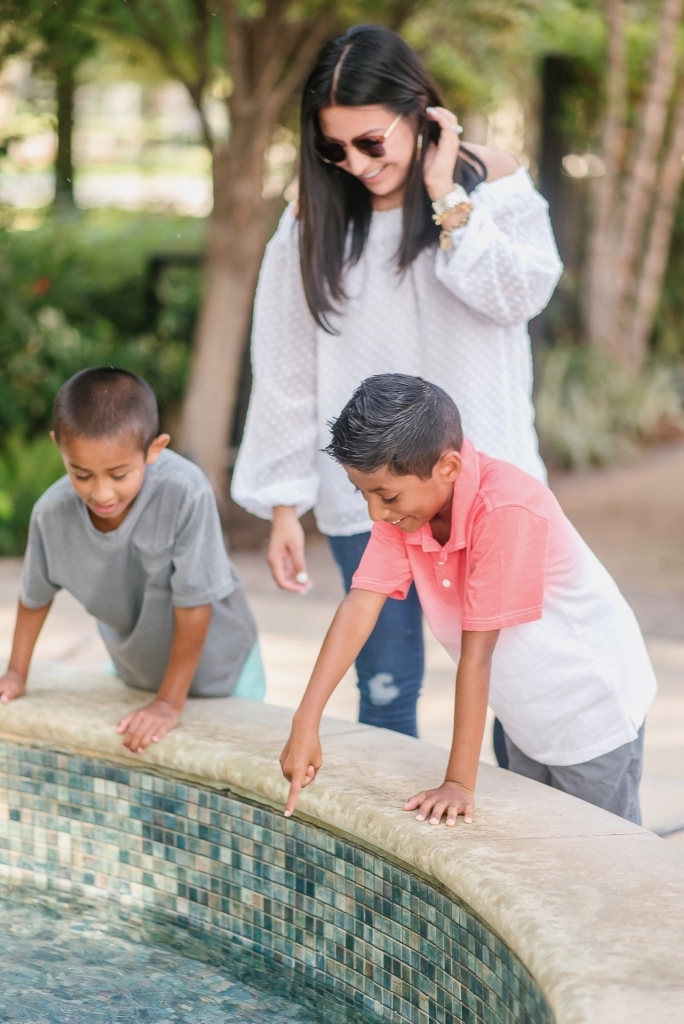 Back to School Style with Walmart by popular Texas fashion blog, Lux Mommy: image of a mom and her two boys looking in to a fountain. 