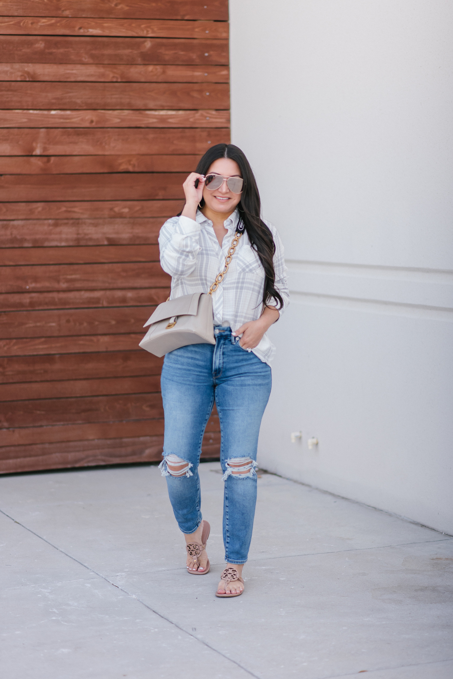 Houston top fashion and lifestyle blogger LuxMommy styles Nordstrom ripped jeans, button up top, and Balenciaga bag