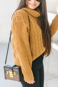 Louis Vuitton petite malle, black jeans, chunky sweater