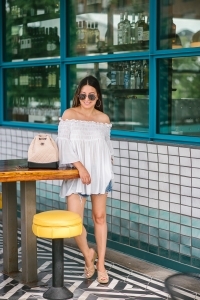 Chanel Gabrielle backpack, White smocked off the shoulder top, quay Jaclyn Hill sunglasses, american eagle midi shorts, Michele watch, stella and dot renegade bracelet, kendra scott charm bracelet, Walmart espadrilles