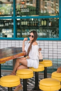 Chanel Gabrielle backpack, White smocked off the shoulder top, quay Jaclyn Hill sunglasses, american eagle midi shorts, Michele watch, stella and dot renegade bracelet, kendra scott charm bracelet, Walmart espadrilles