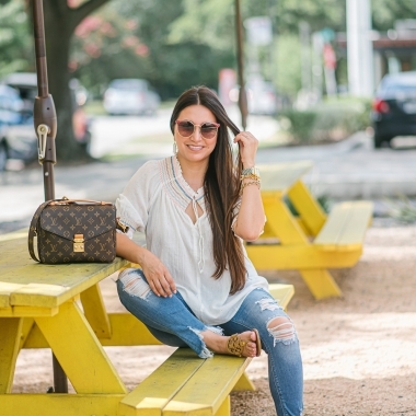 Rainbow smocked top styled for summer by top US fashion blog, LuxMommy: image of a woman wearing a Madewell rainbow smocked top, Express mid rise jeans, Tory Burch flip flops, Kendra Scott drop earrings, Michele diamond watch, Stella & Dot spike bracelet and Louis Vuitton crossbody bag.