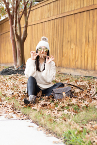 Houston fashion blogger and youtuber LuxMommy styles in Spanx faux leather leggings, walmart sweater, walmart snake print boots and walmart beani
