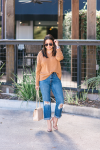 Houston top fashion blogger LuxMommy styled in Good American jeans, madewell sweater, louboutin shoes, Chanel jumbo flap and Kendra Scott jewelry
