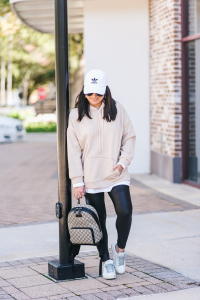 Houston top fashion blogger athletic style in an oversized hoodie, leggings and Gucci backpack