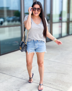 Houston top fashion and lifestyle blogger LuxMommy styles basic tee, cutoff denim shorts, and Prada sandals